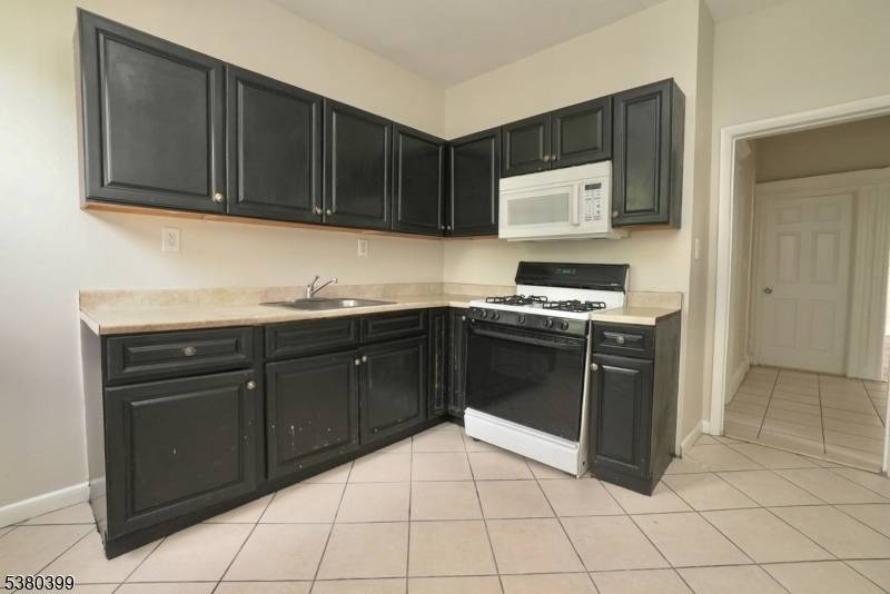 Welcome to this spacious multi family home located in the heart of East Orange.