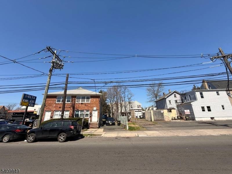 Corporate owned legal 4 family brick property with two full basements.