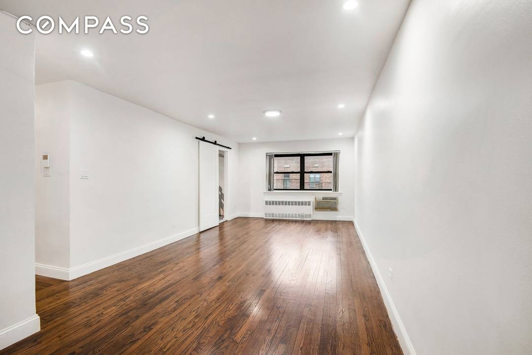 57 10 Junction Boulevard, Unit 6J is a top floor, corner three bedroom, one and a half bath residence offering space, light, and long term flexibility in the heart of ...