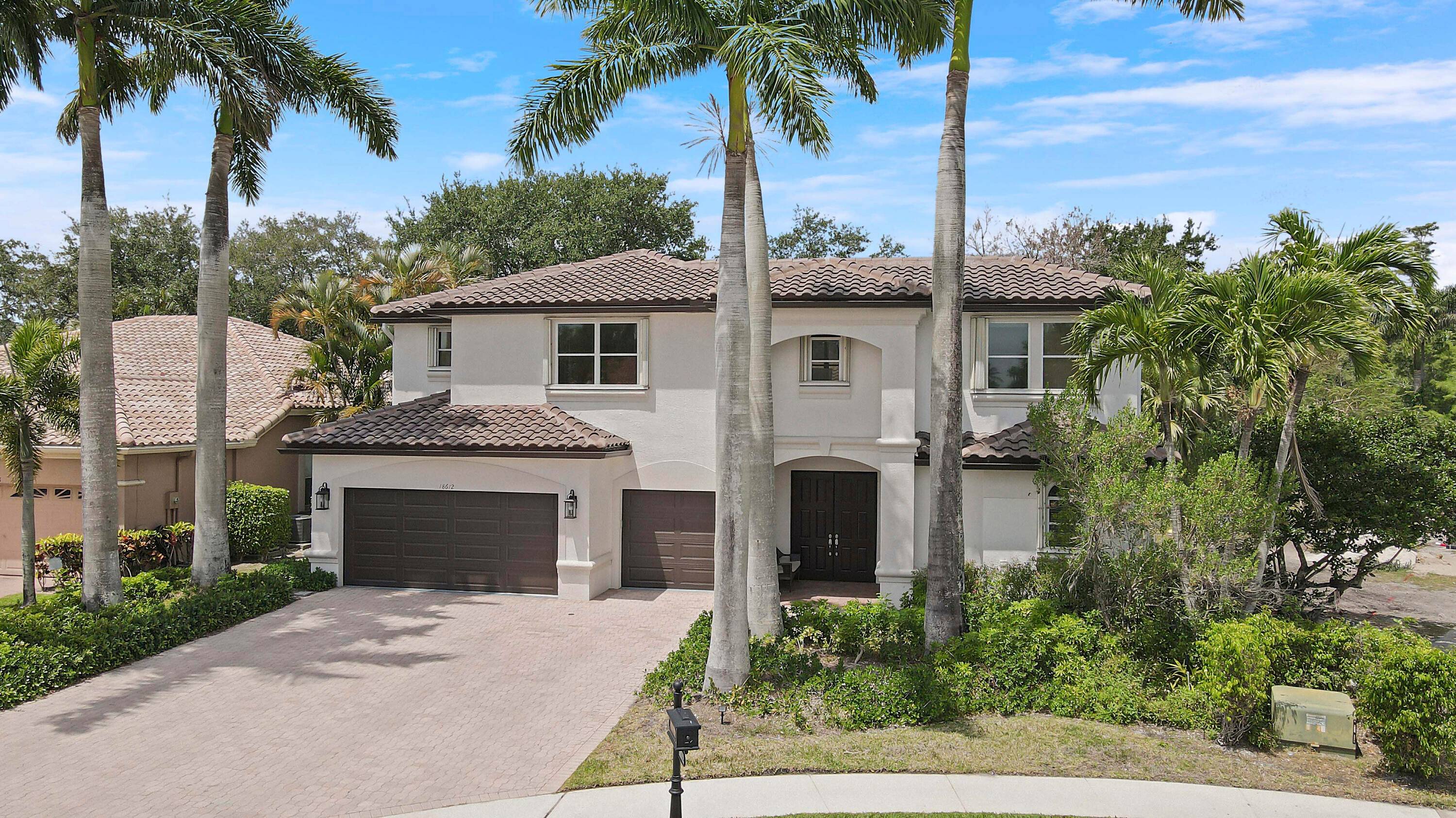 Welcome to this meticulously maintained 5 bedroom residence nestled in the prestigious, gated community of Boca Isles.