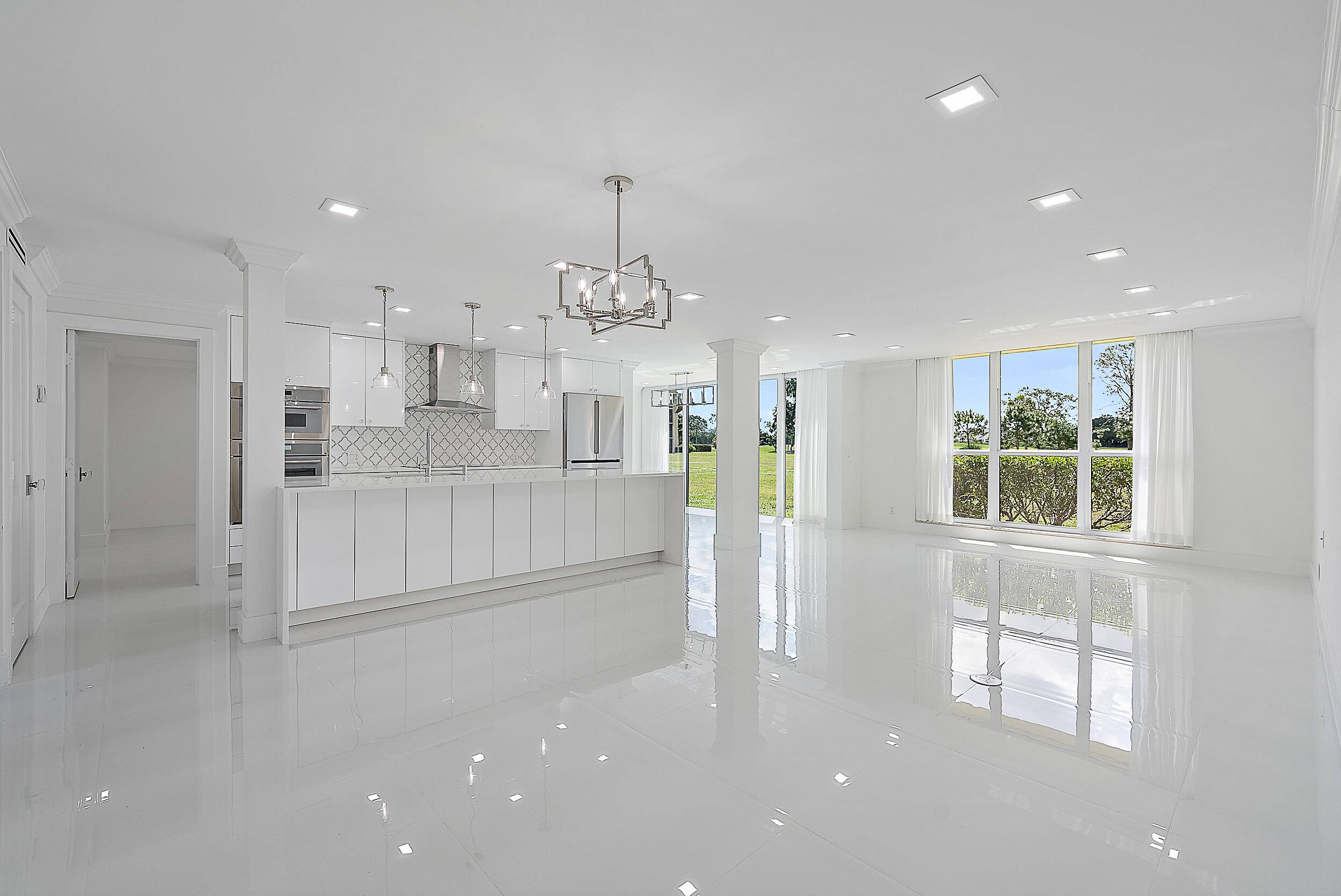 Experience luxury living in this one of a kind, beautifully remodeled 2 BR condo perfectly situated on the ground floor w spacious split open floor plan truly a designer's dream.