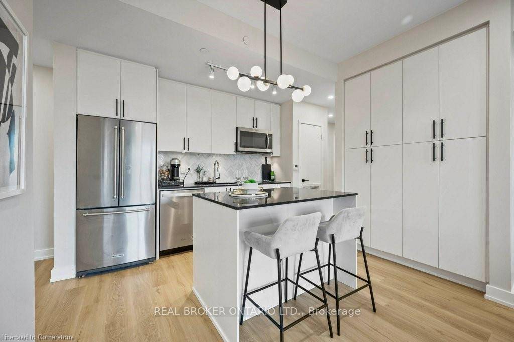 Welcome to this beautifully updated 2 bedroom den, 2 bathroom ground level condo offering nearly 1, 000 sq.