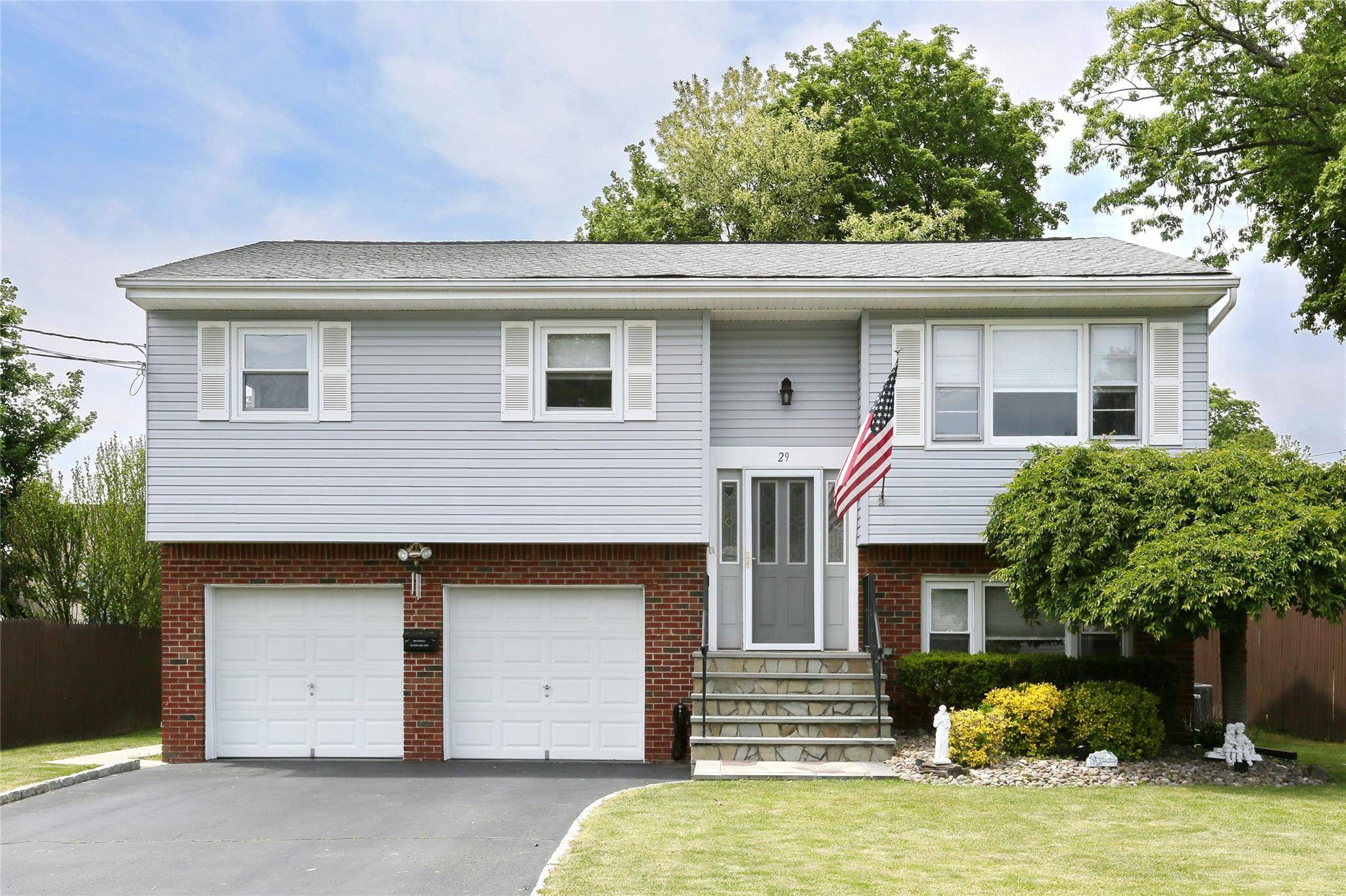 This bright and sunny, traditional high ranch style home feels comfortable and pleasant !