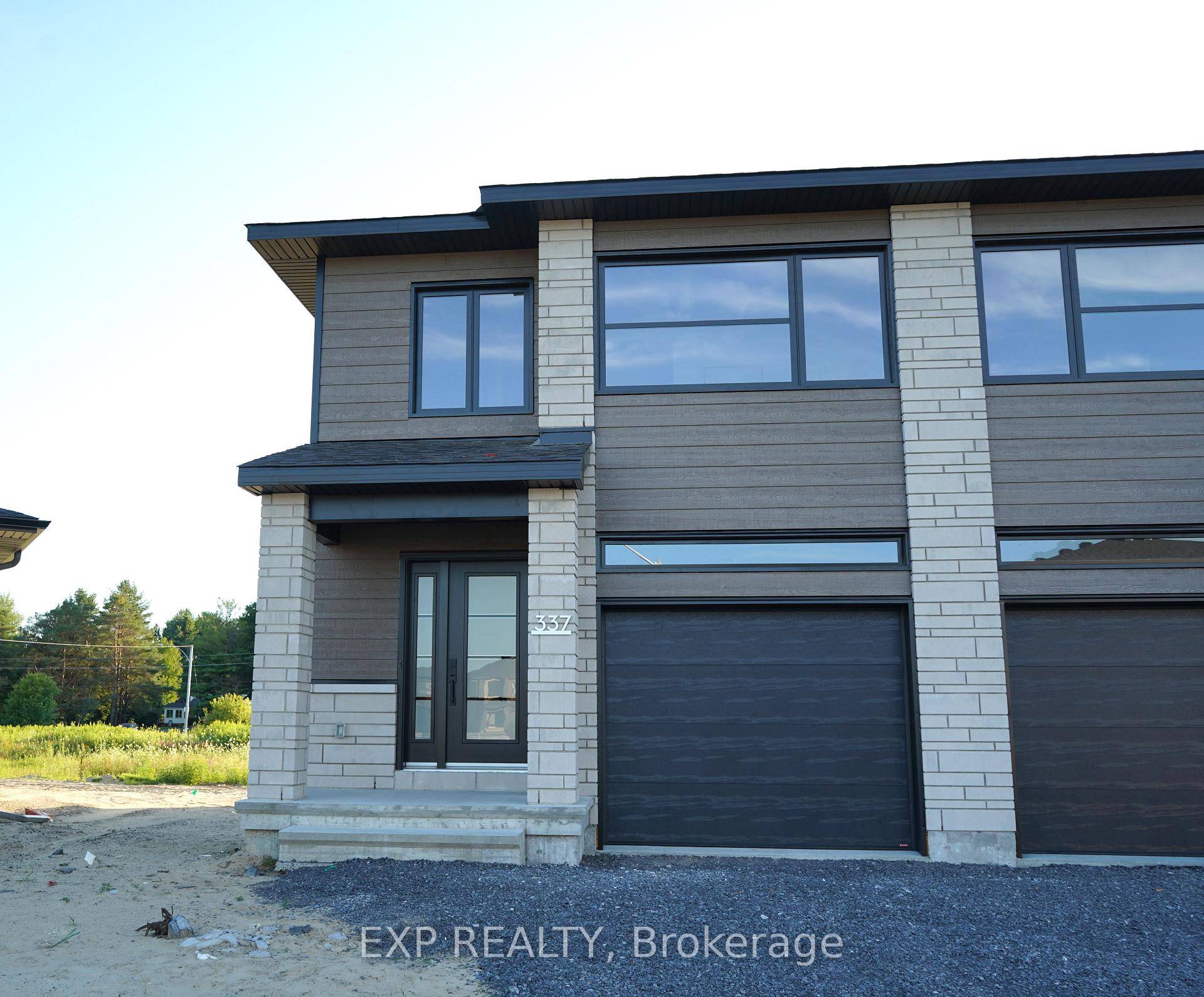 Welcome to White Rock end unit, a gorgeous townhome on a premium lot featuring a bright open concept layout with a chef's kitchen including an island and walk in pantry.