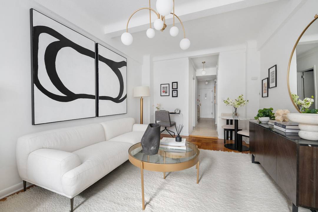 Welcome to Apartment 704, a prewar studio with high ceilings and southern exposure in a luxury coop just minutes from Central Park.