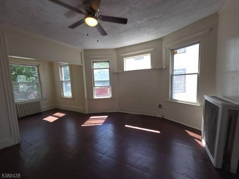 Welcome to 80 Eppirt Street, a spacious Colonial style home set on a large lot in East Orange.
