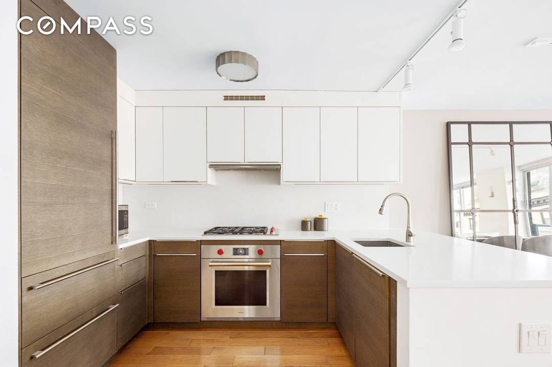 Welcome to Residence 11BC, a beautifully combined two bedroom home with a private balcony and open city views.