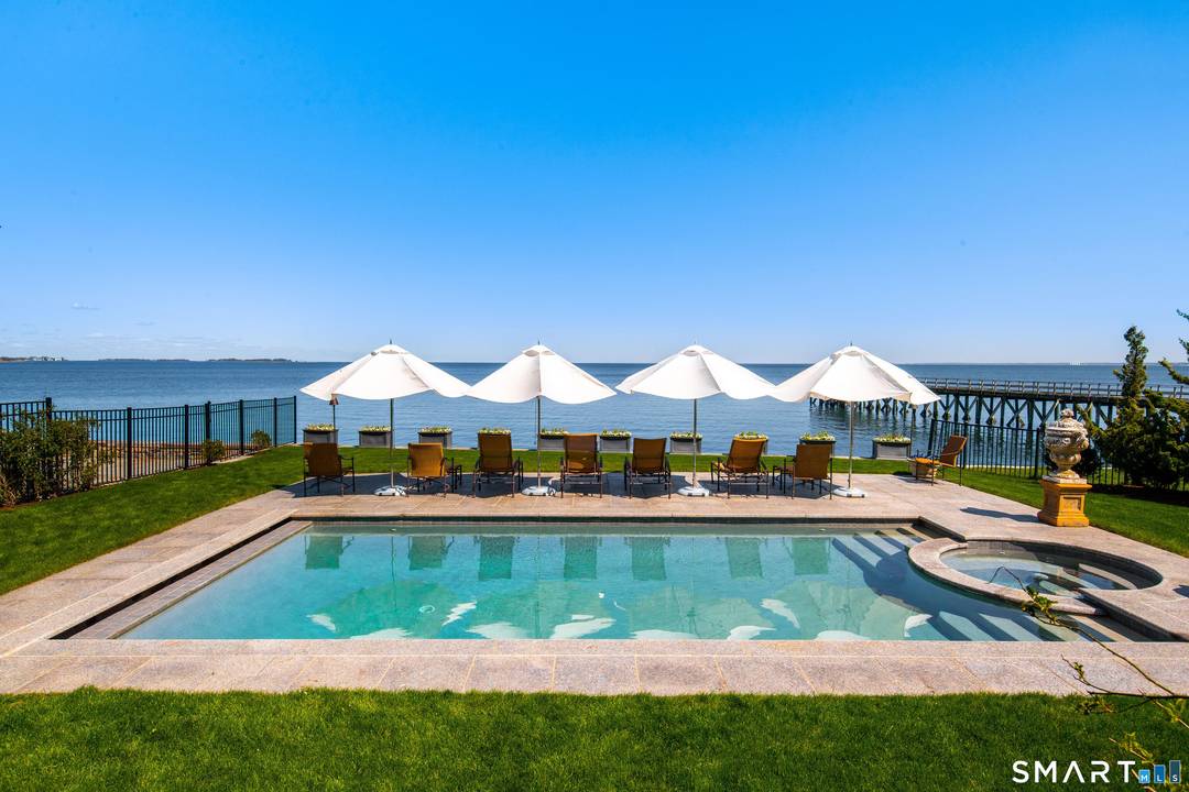 This dramatic property offers 200 feet of waterfront frontage with your own private beach in the premier Long Neck Point area of Darien.