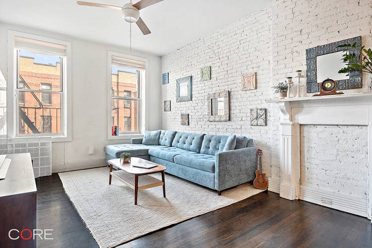 This bright and airy home features nine windows in total, a spacious living and dining area ideal for entertaining, gorgeous hardwood floors, and a beautifully renovated, custom designed kitchen.