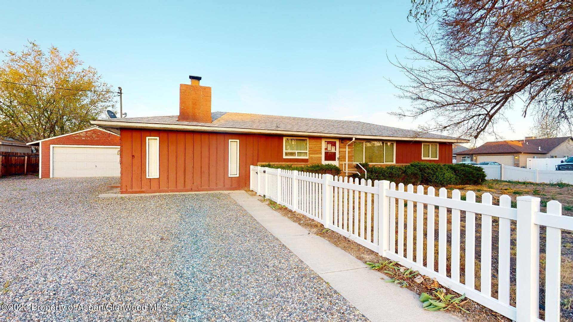 This charming 2 bedroom, 1 bathroom home boasts a detached garage workshop, situated on a large lot with a fenced yard and private patio.