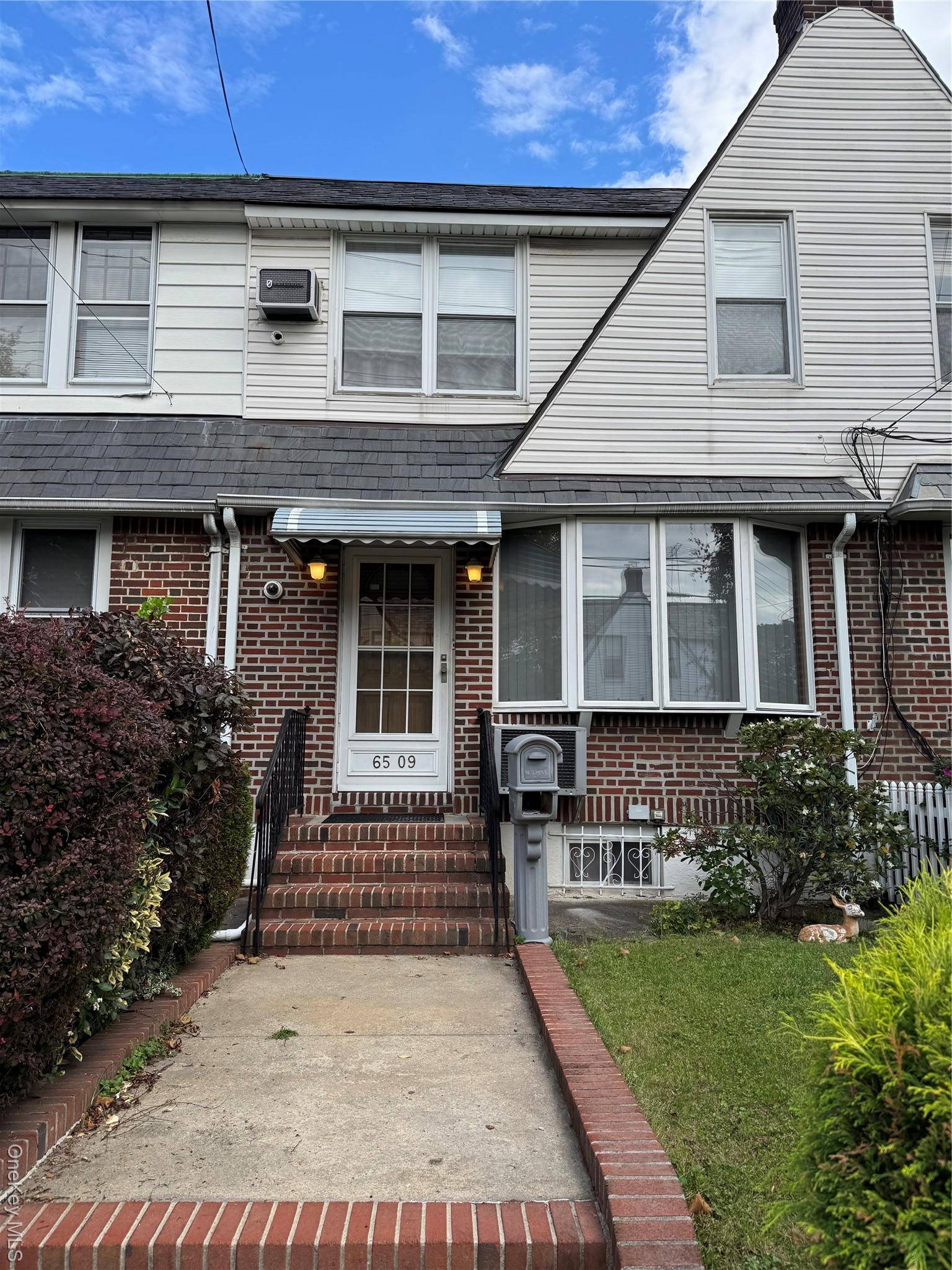 This lovely 1 family townhome prime location, well maintained on a quiet tree lined block in Middle Village.