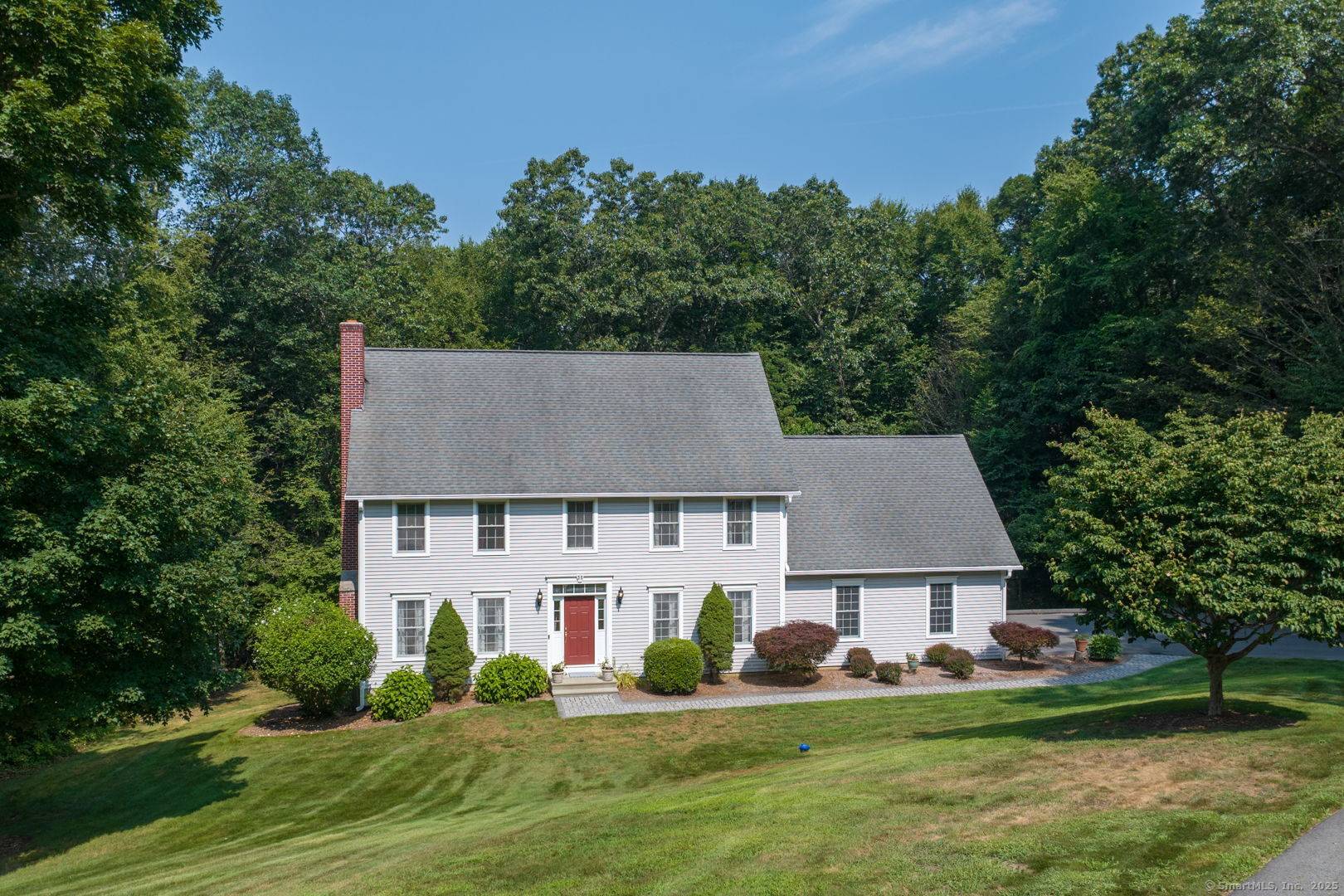 Welcome to 35 Comstock Trail, where timeless elegance meets modern comfort.