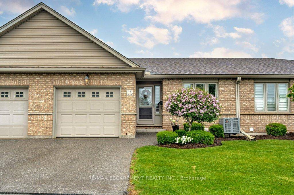 PRICED TO SELL ! A Tranquil Townhome Bungalow Backing Onto Greenspace.