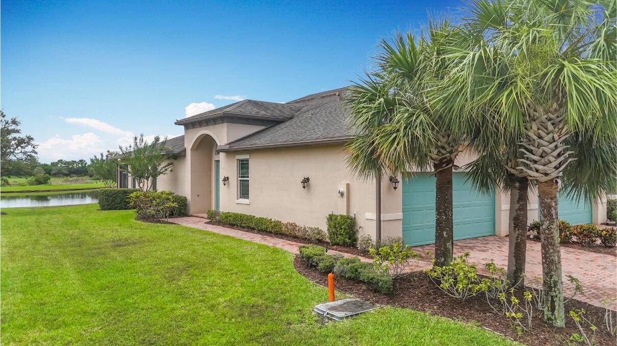 Wide water view ! 2 bedroom PLUS den in the beautiful community of Lake Park in Tradition.
