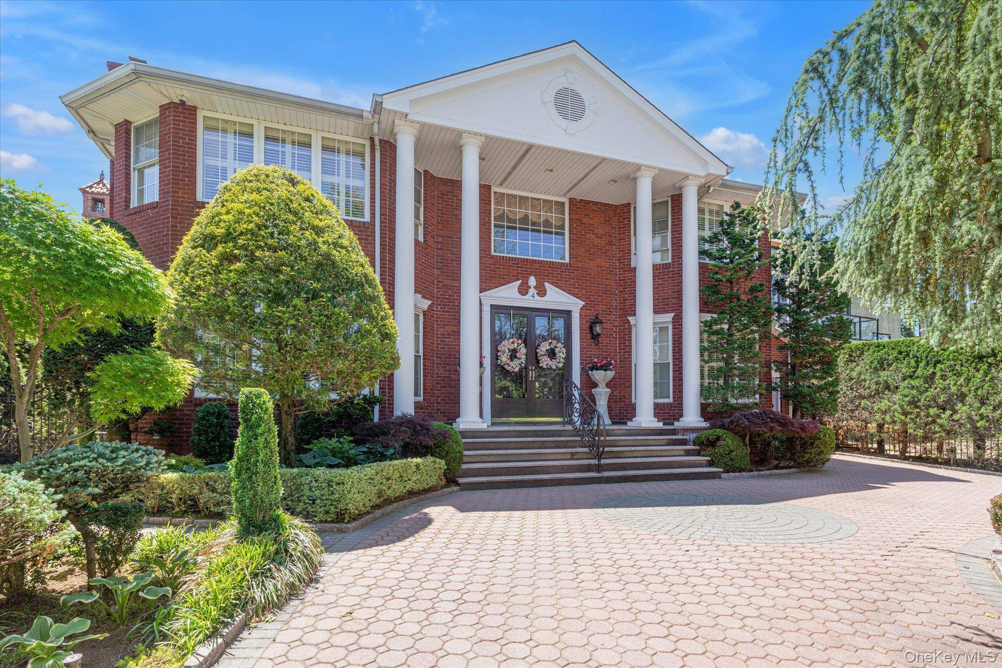 Unparalleled water views and timeless elegance welcome to this Malba estate located ideally across from a sandy local beach and overlooking the iconic Whitestone Bridge.