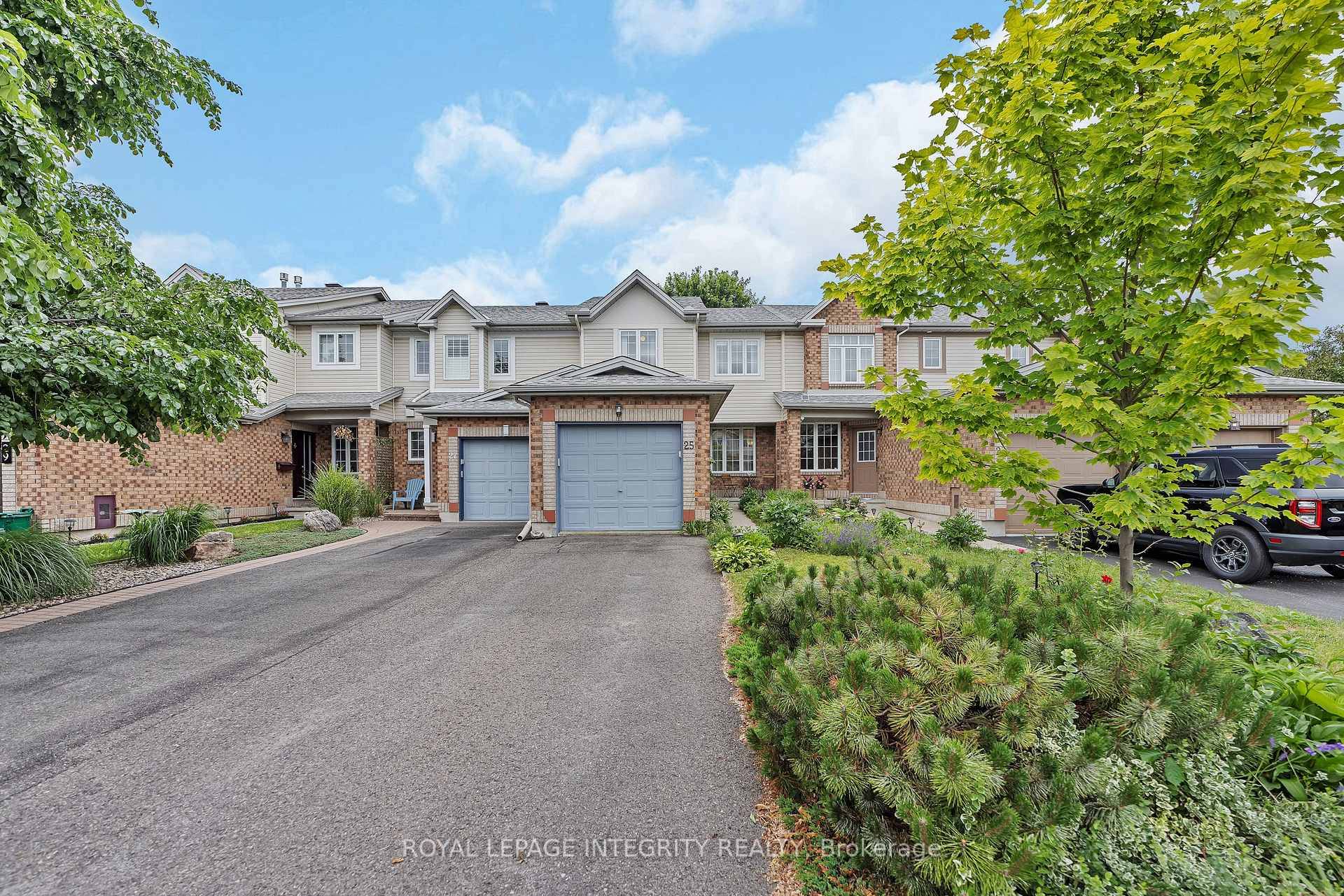 Welcome to this beautifully maintained 3 bedroom townhome featuring an open concept main level with beautiful hardwood floors.