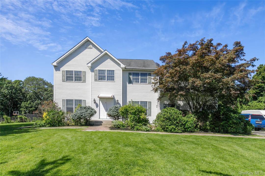 Nestled on a cul de sac in Melville, this spacious Center Hall Colonial Built in 1998 is set on 1.