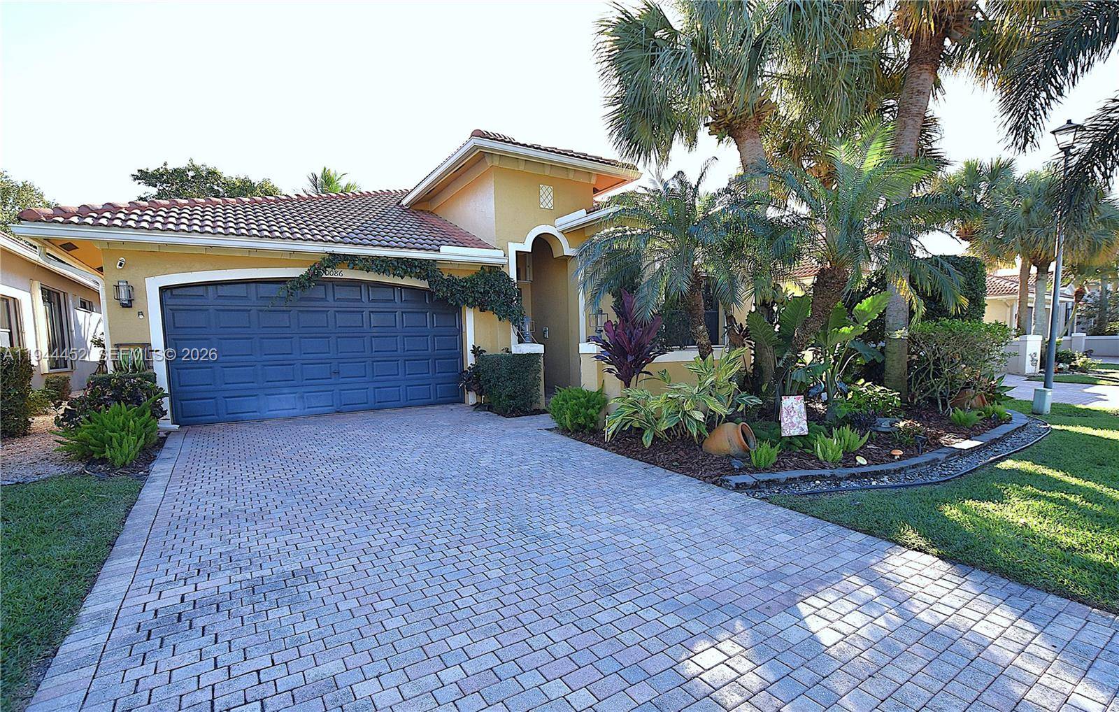 This beautifully updated 3 bedroom home in Tivoli Lakes greets you with a spacious open floor plan, a charming foyer, and lush landscaping surrounding the front, sides, and back.