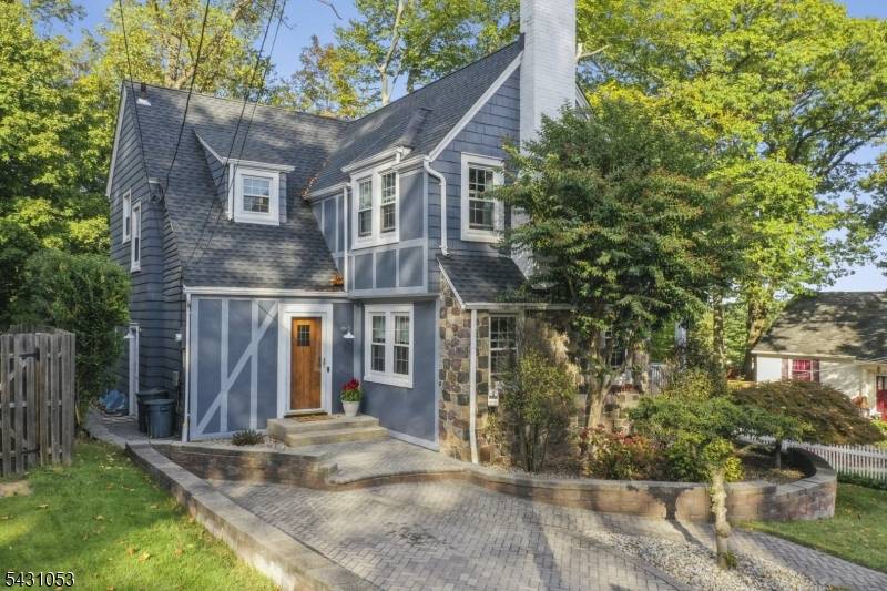 Nestled on a quiet, tree lined block, this Storybook Tudor has been thoughtfully renovated to preserve its original character while integrating modern comfort.