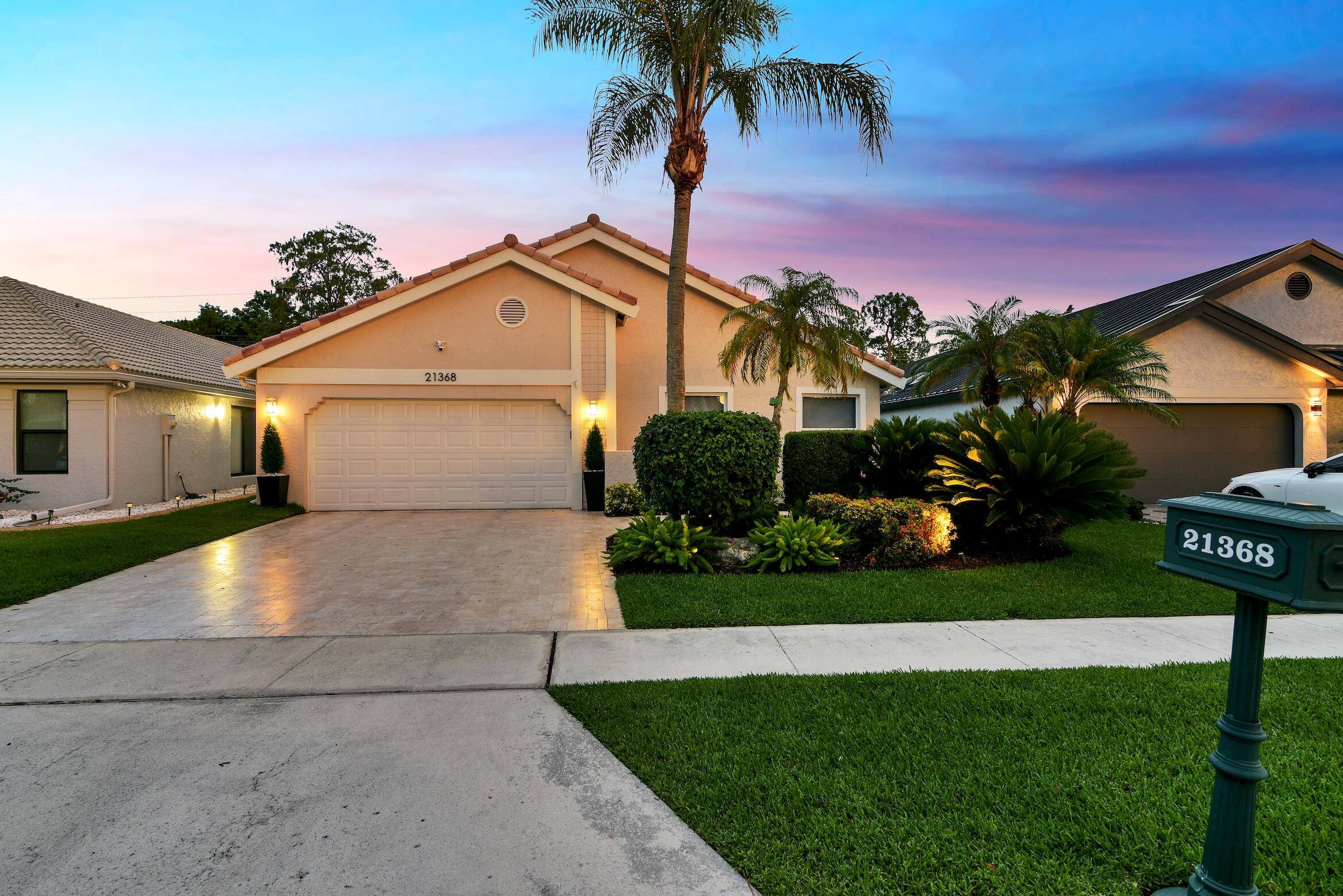 Step into your Tropical Oasis with this Beautifully Renovated 3 bedroom 2 Bathroom Residence offering a Tranquil Picturesque Setting and View of the 4th Hole of The Lakes Golf Course.