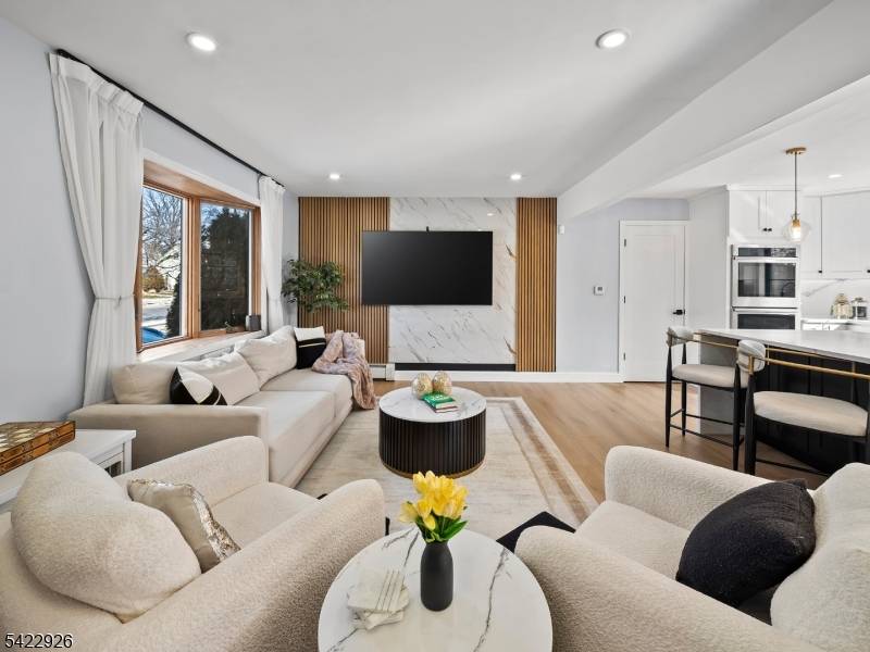 Welcome to 43 Ploch Road, a beautifully remodeled residence in the desirable Albion section of Clifton.