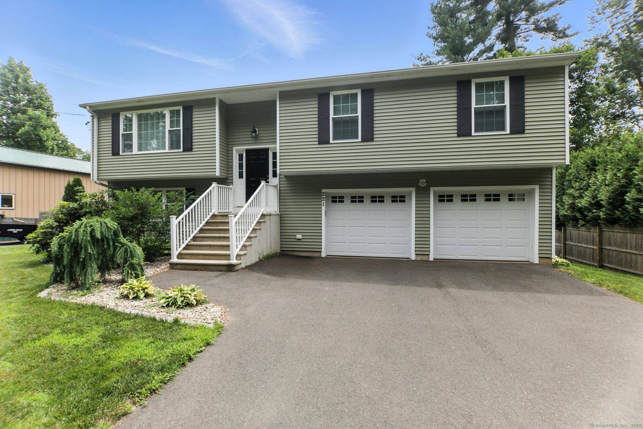 Immerse yourself in warmth and comfort in this raised ranch home's inviting interior, featuring rich wood flooring flowing through the living areas, central air conditioning for effortless relaxation, and abundant ...