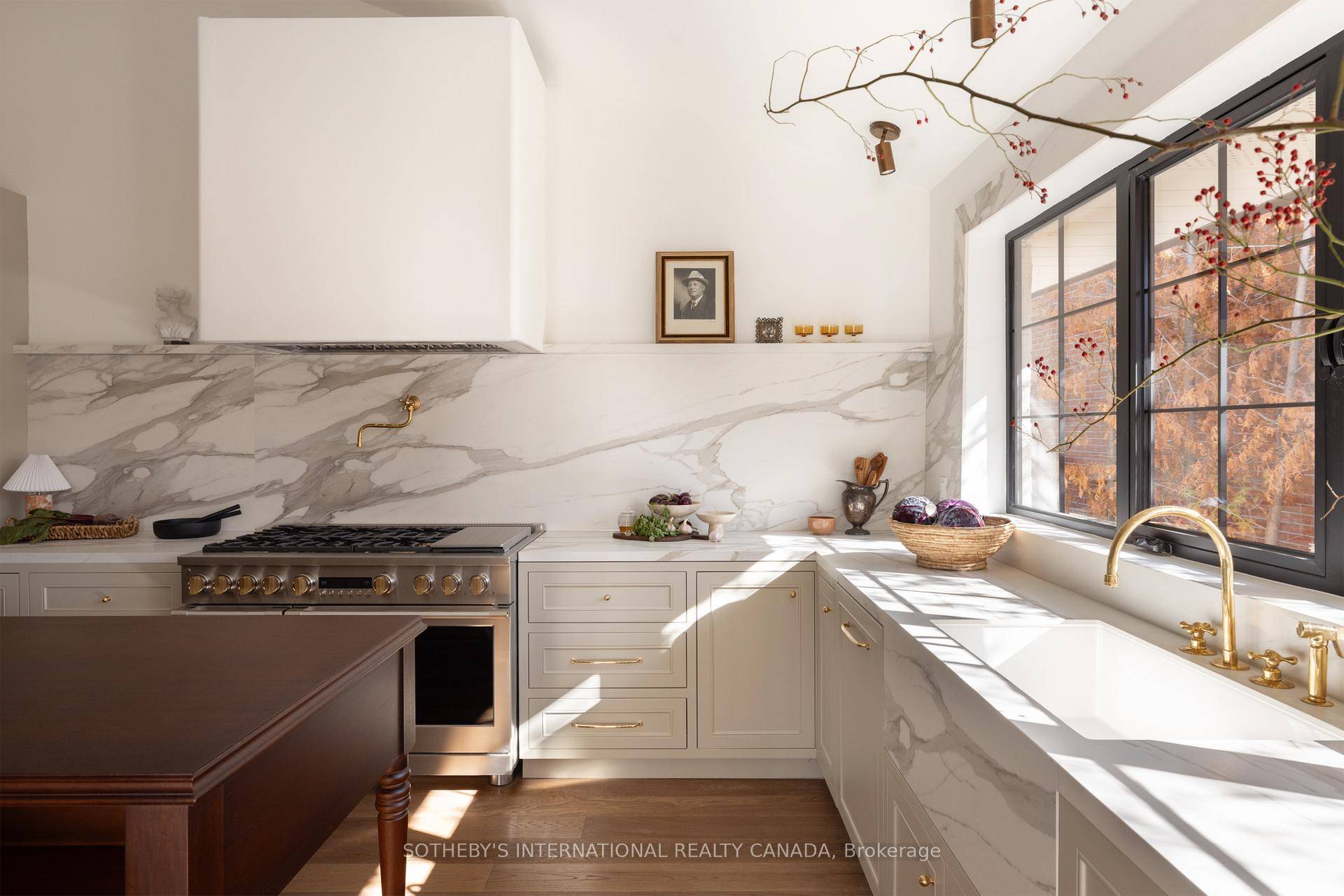 Impeccable 5 bedroom, 5 bath, residence with 2 kitchens, double laundry amp ; walk up basement.