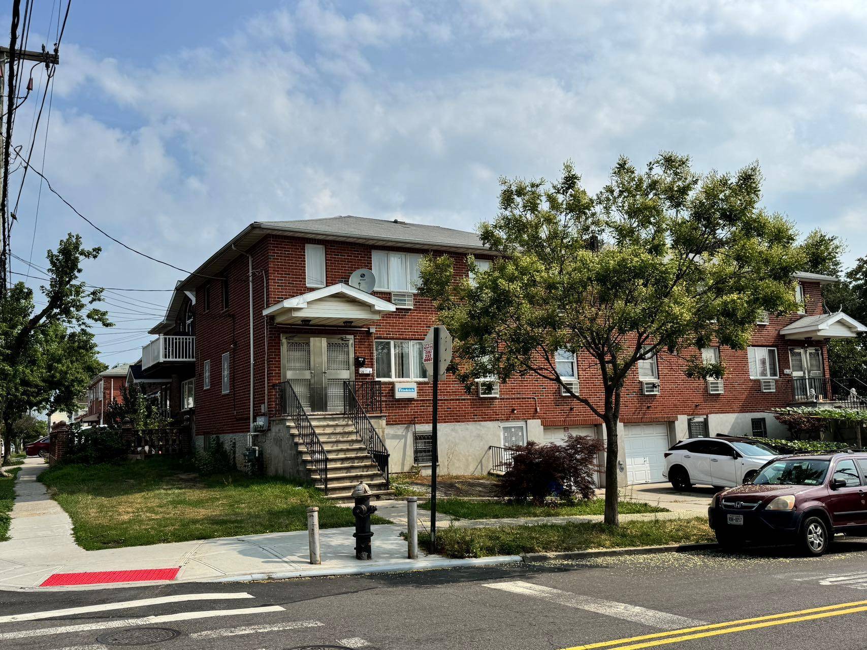 This young, semi detached, two family brick home sits on a 51x50 corner lot in excellent condition, offering privacy and endless potential.