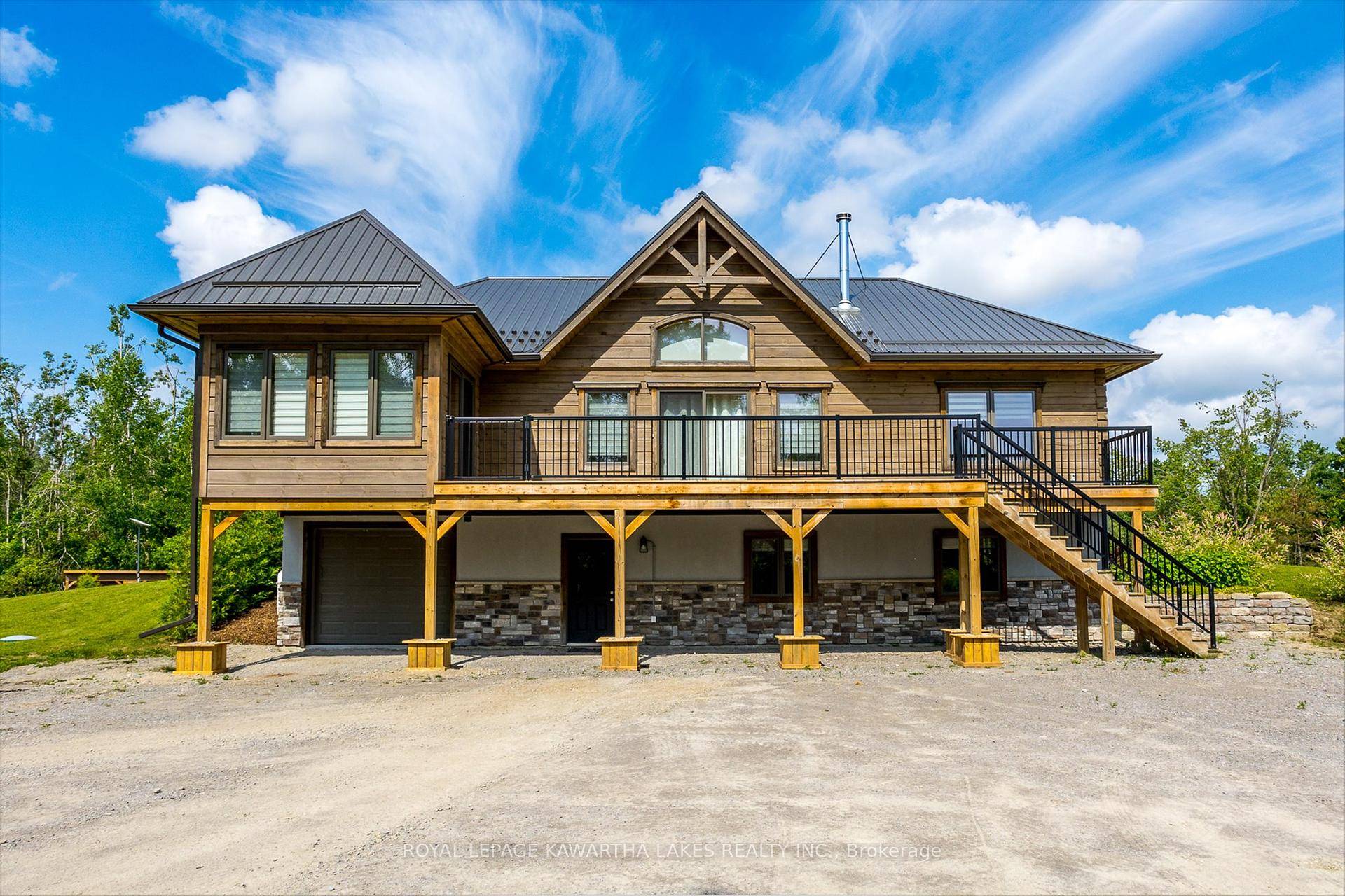 Escape to your own private sanctuary with this stunning log home nestled on approx 50 acres.