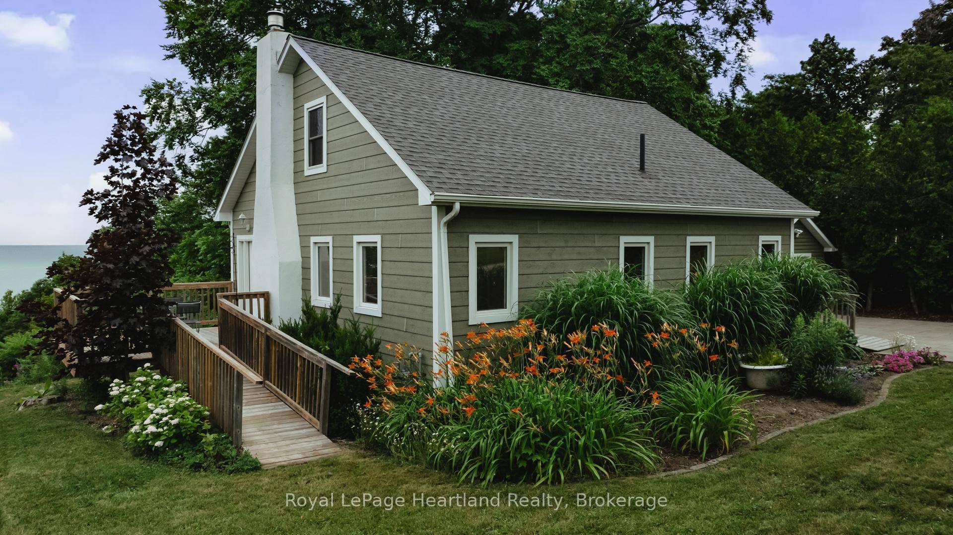 Enjoy your own private sandy beach plus the convenience of municipal services that this Bayfield cottage has to offer !