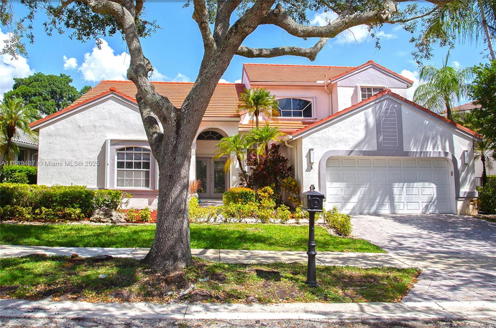 Elegant two story home located in the prestigious Weston Hills community, featuring a south facing front and a north facing backyard.