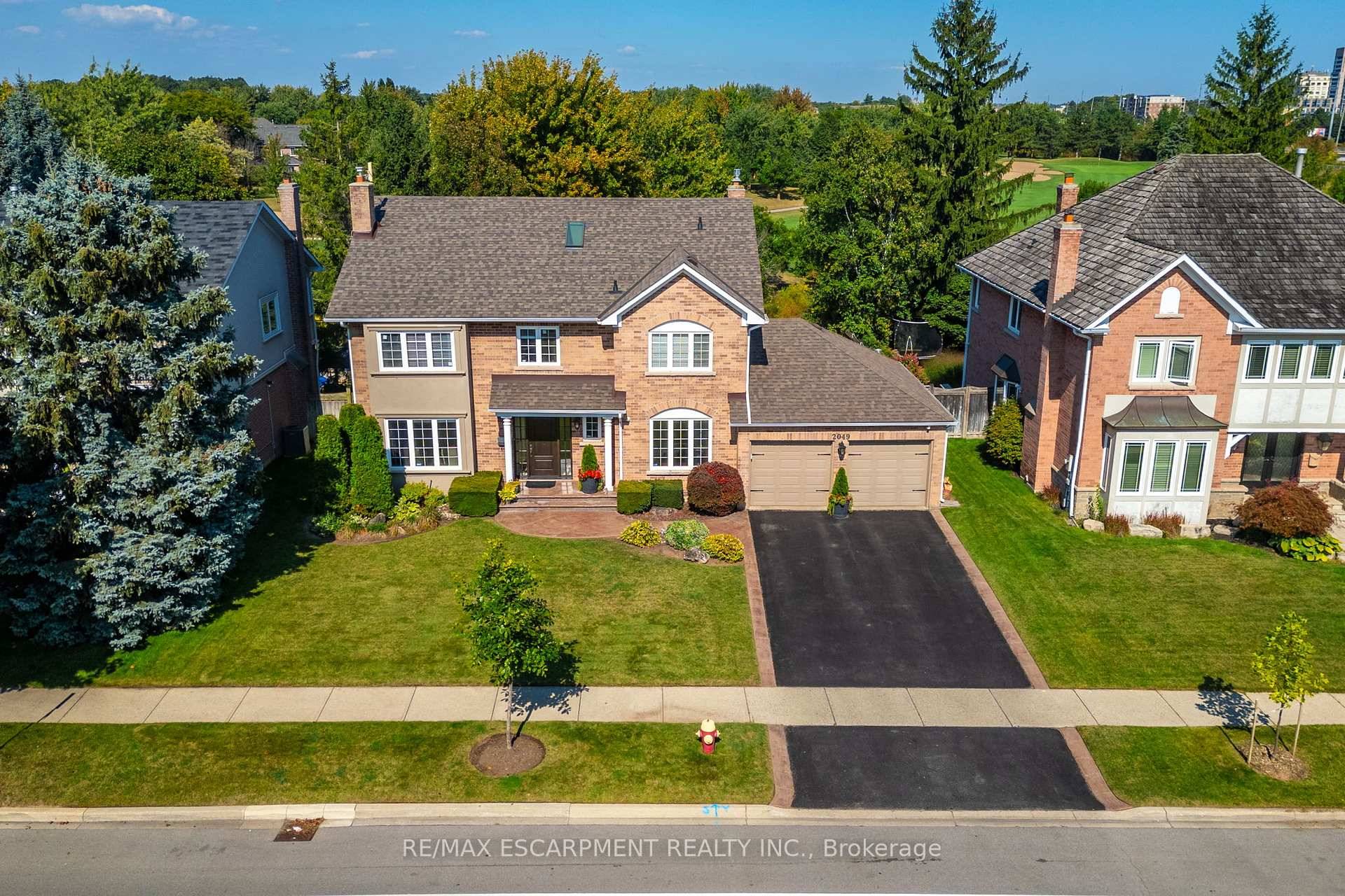This fabulous previous model home boasts timeless curb appeal with its classic brick exterior and symmetrical design.