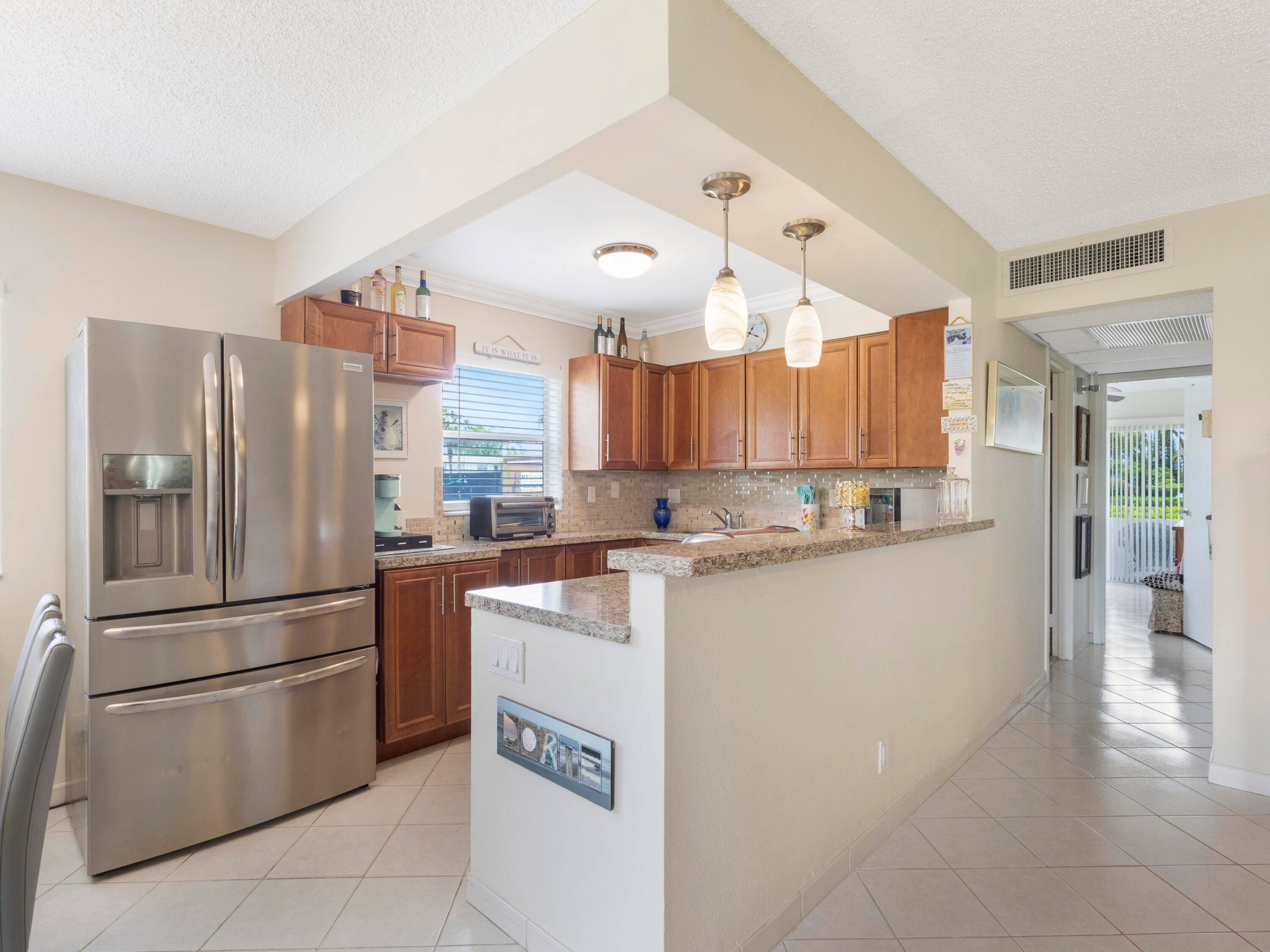 THIS IS THE ONE ! ! ! True corner Condo 1st floor 2 Bed 2 Bath steps from Monaco Clubhouse.