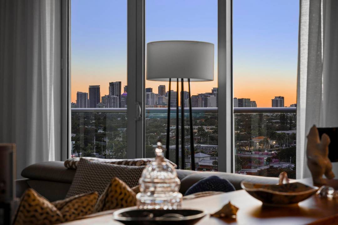 Sophisticated urban retreat with dramatic sunset amp ; city views.