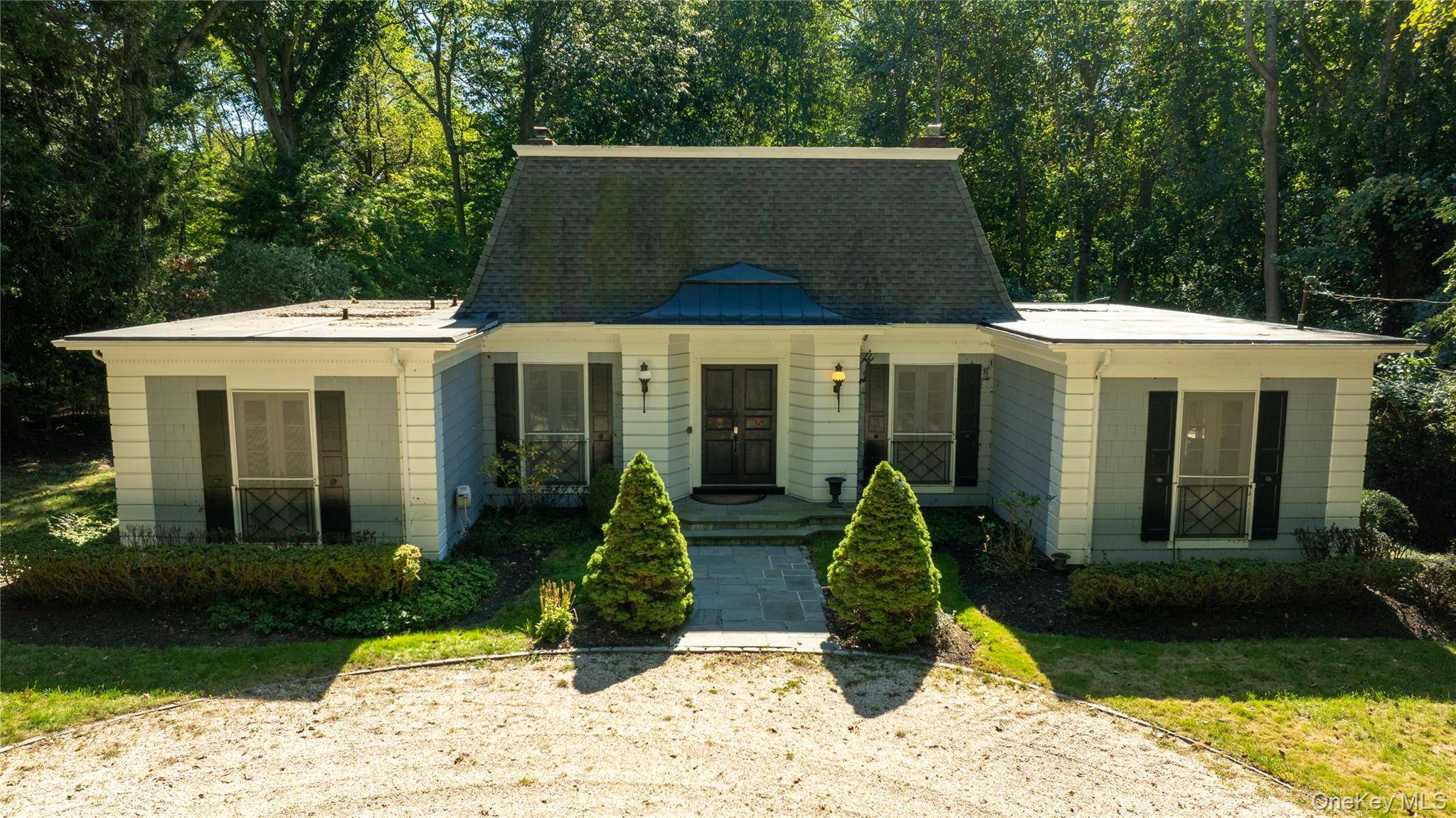 Step into a world of elegance and tranquility at this stunning Colonial home, nestled in the picturesque Village of Nissequogue.