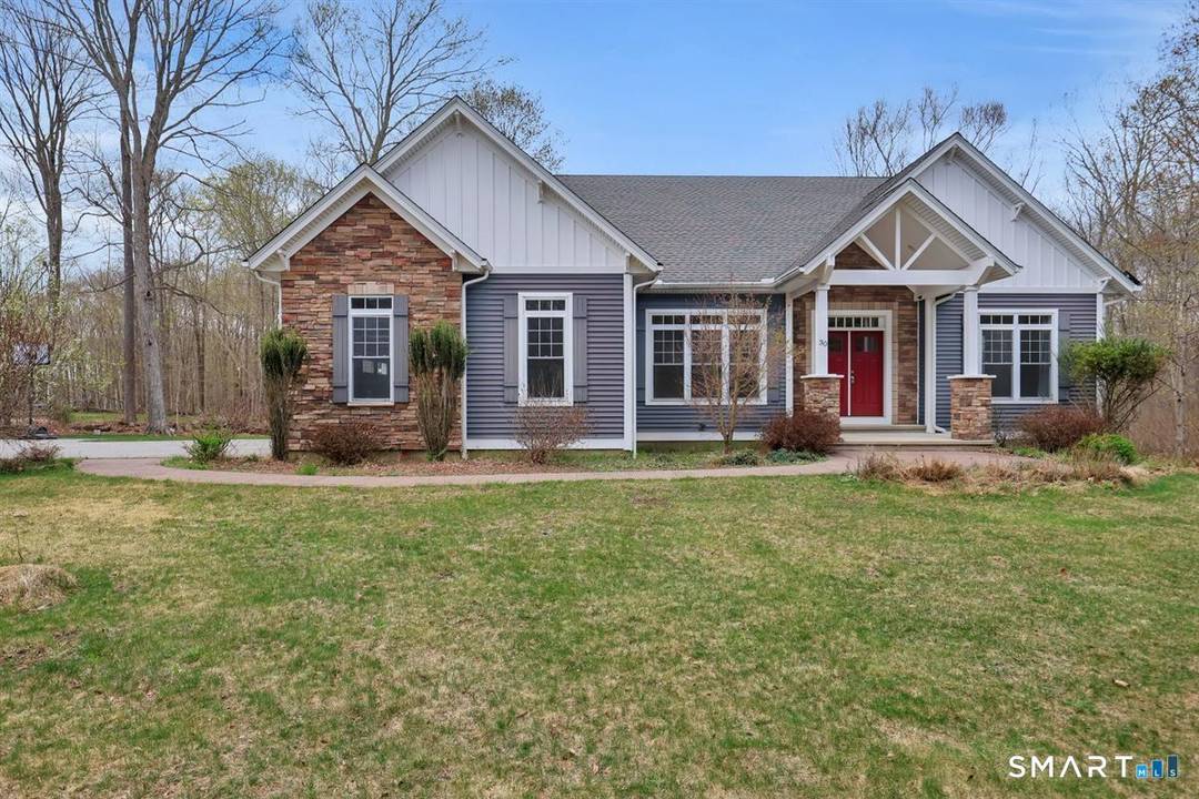A beautiful and customized sunny Cape in a desirable neighborhood close to UConn and all shopping.