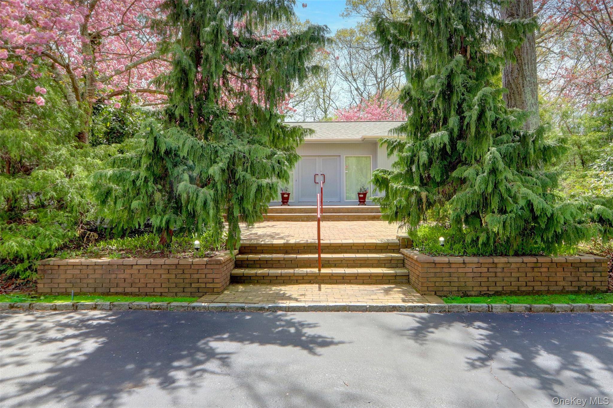 Set on 1. 2 beautifully landscaped acres in the sought after Village of Belle Terre, this one of a kind 3, 300 sq ft home features a dramatic entry with ...