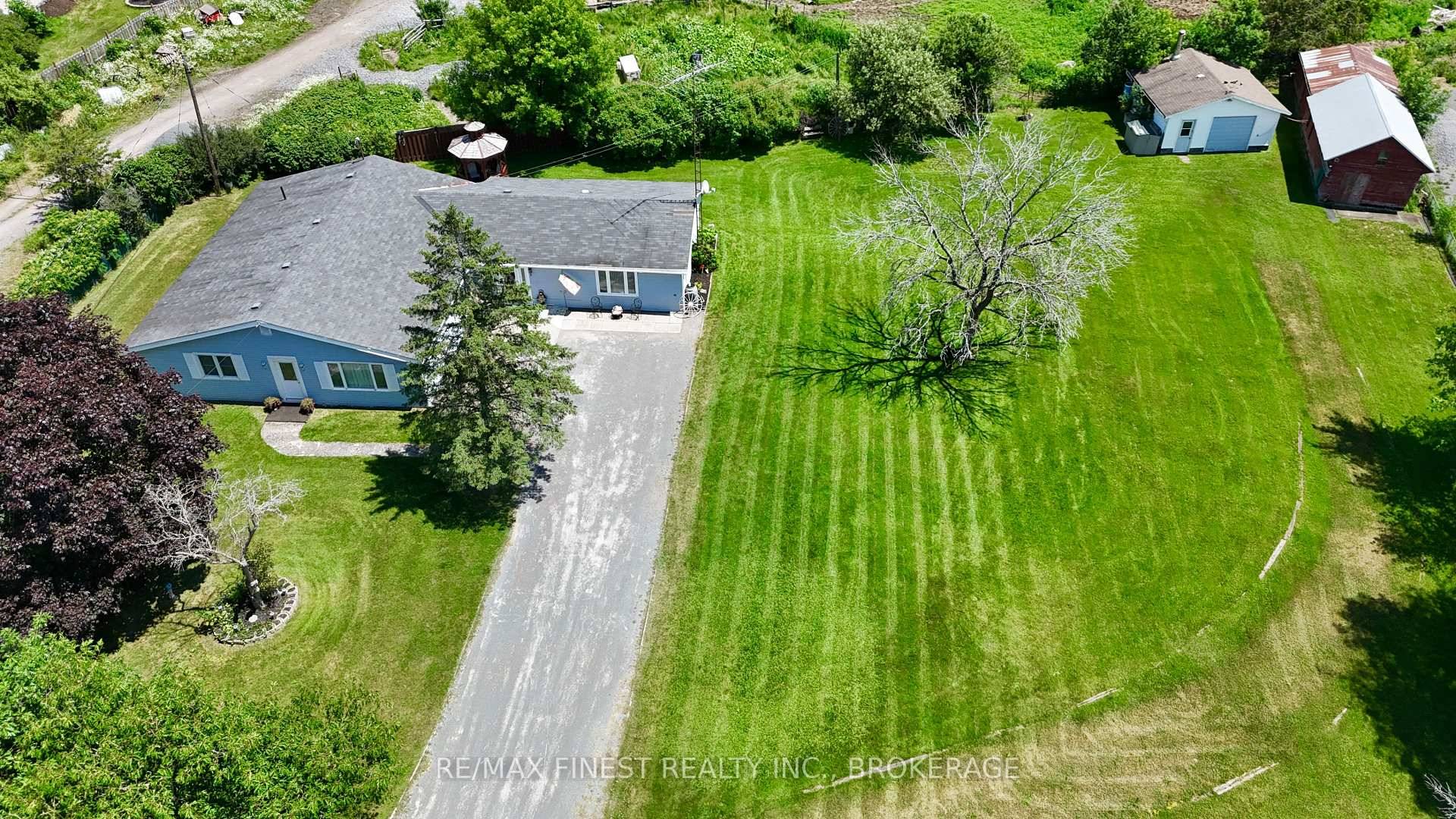 BEAUTIFUL ! ! ! This 2300 SQ' Slab on Grade Bungalow with NO STAIRS is perfectly set on an acre of property with a detached garage and barn, just 3 ...