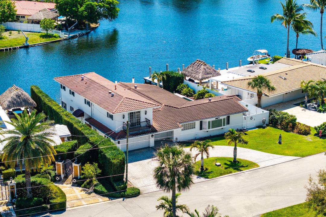Rare POINT LOT waterfront opportunity in the gated Bal Harbour community of Fort Lauderdale near Las Olas, offering 75 ft of deep water frontage on a wide canal with spectacular ...
