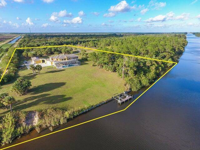 Incredibly built 7 bedroom, 9 full 2 half bathroom pool home on 5 acres.