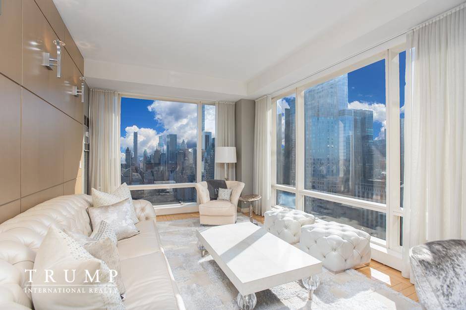 Upon entering this lovely home, you are greeted with bright, natural light and an open floorplan with spectacular views of Central Park and Columbus Circle !