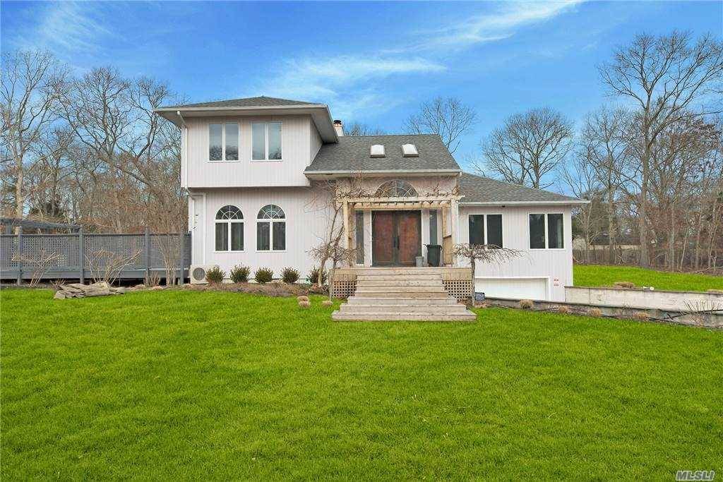 Gorgeous completely updated modern home on a very private flag lot.