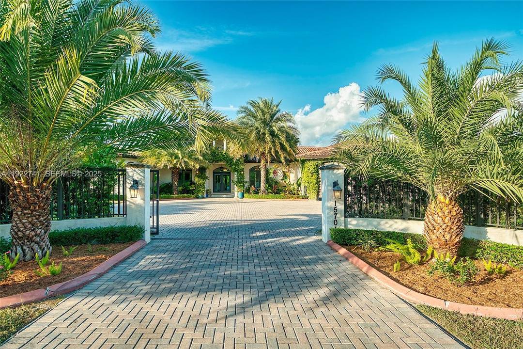Discover luxury, privacy, and lifestyle at this exceptional residence on a lush corner acre in Redland Homestead, designed for comfort and outdoor living.