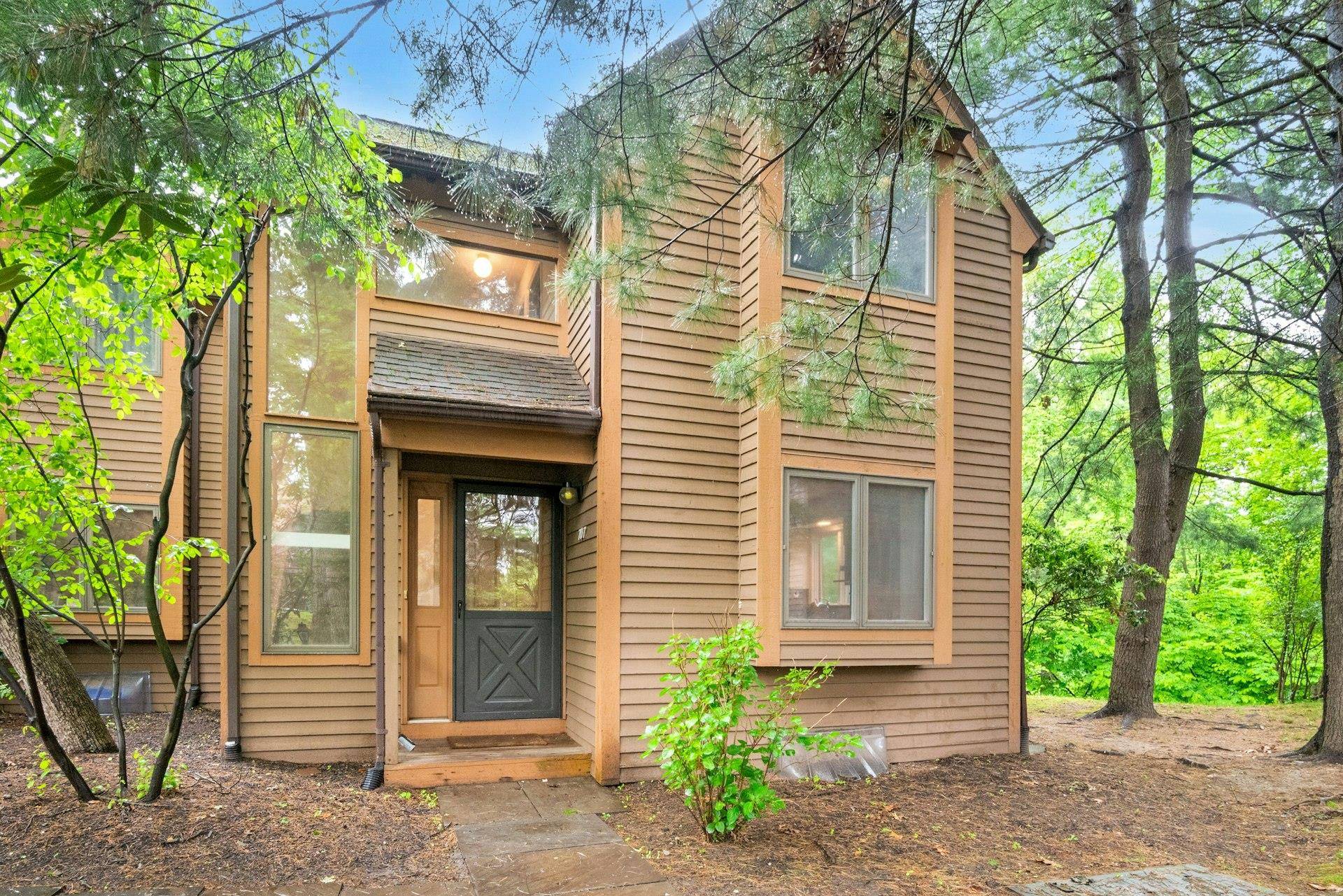 Carefree Rivertown Living Surrounded by Nature Rare End Unit with 2 Deeded Garages Enjoy effortless living in this bright and spacious end unit townhome.