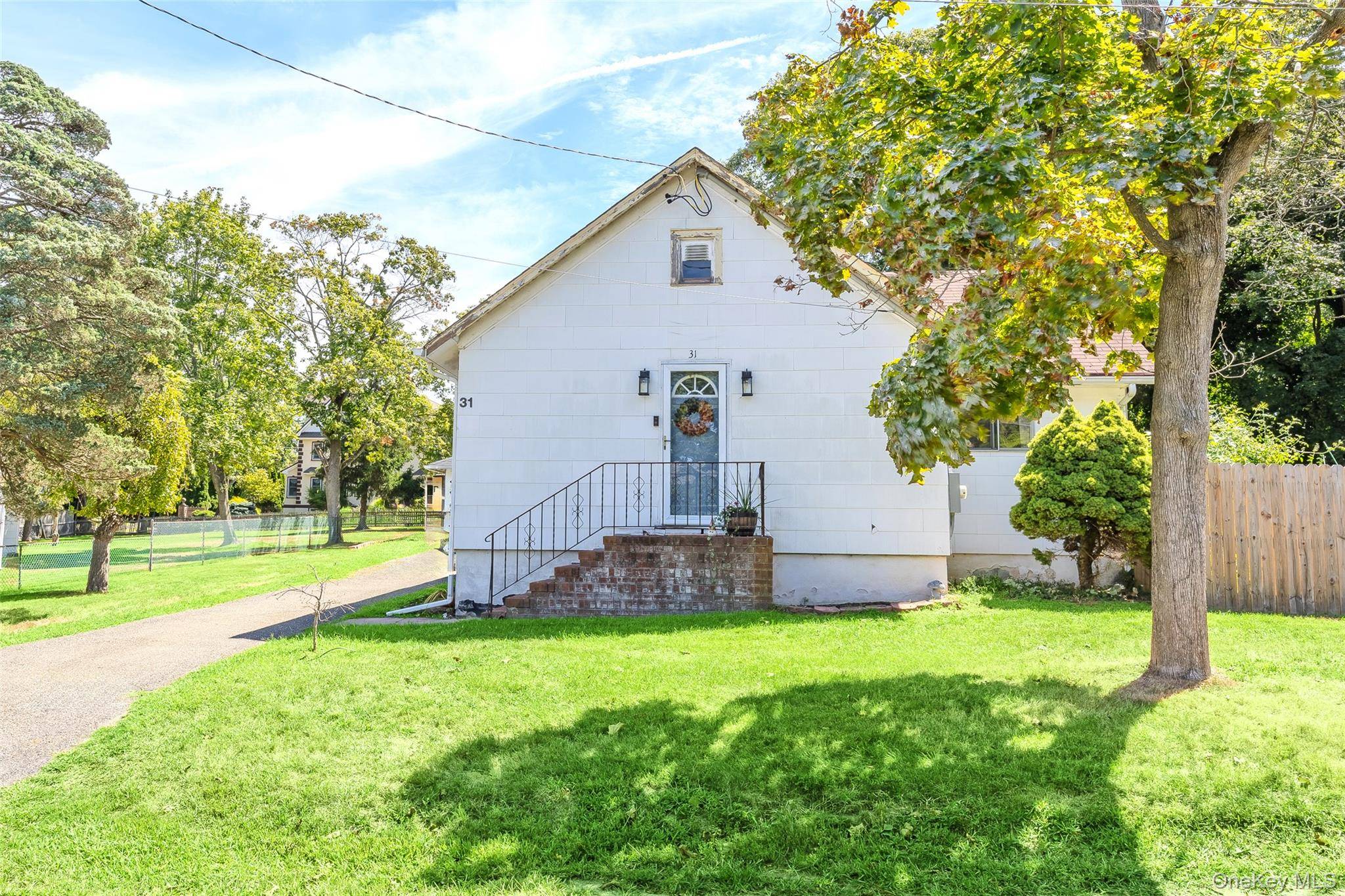 Location ! Location ! Welcome to this beautifully updated 2 bedroom, 2 bath ranch nestled on a quiet, tree lined street in the desirable community of Rocky Point.