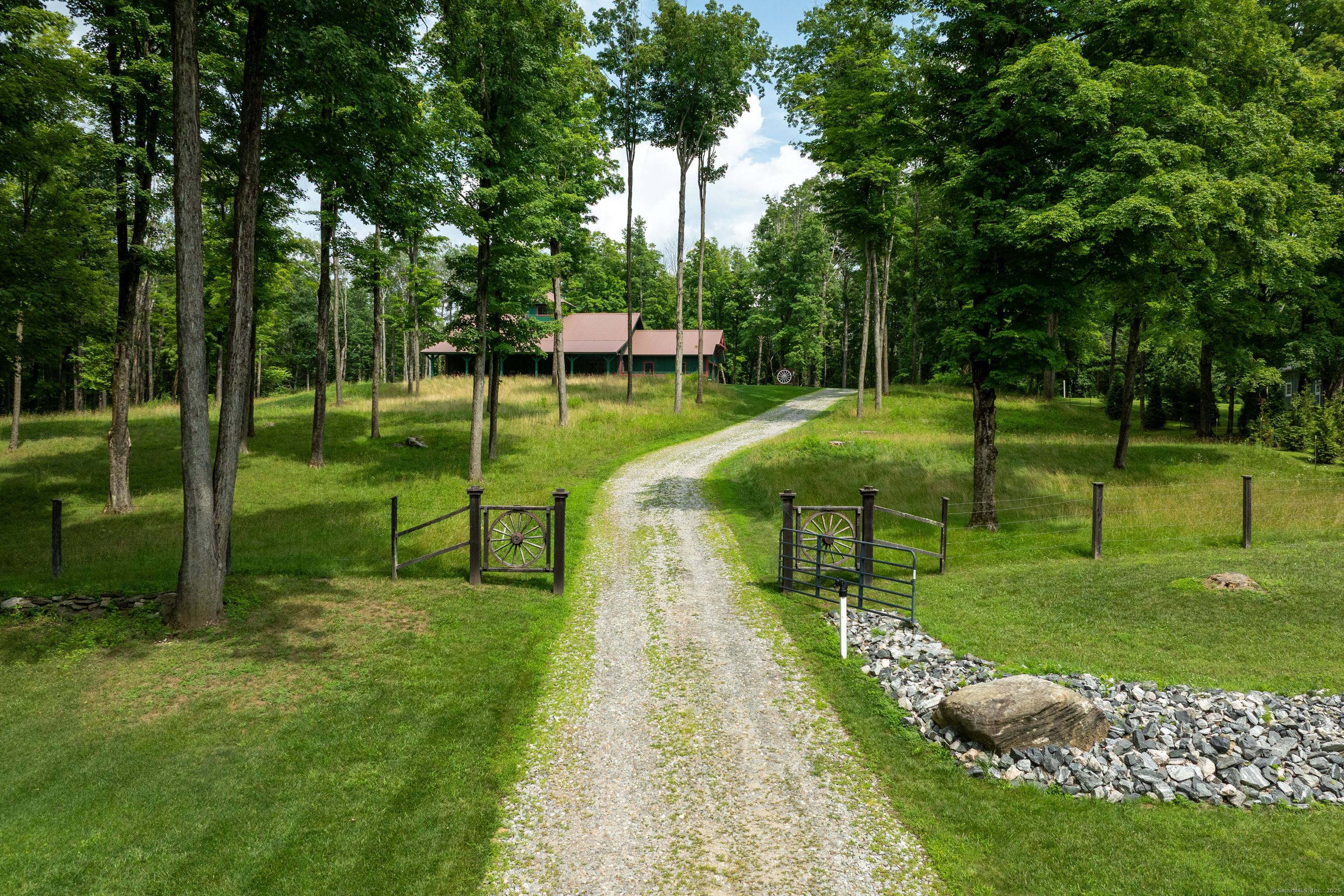 Set high on a hill and privately tucked back from the road, this custom built Post Beam home is a rare blend of craftsmanship, comfort, and sustainability.