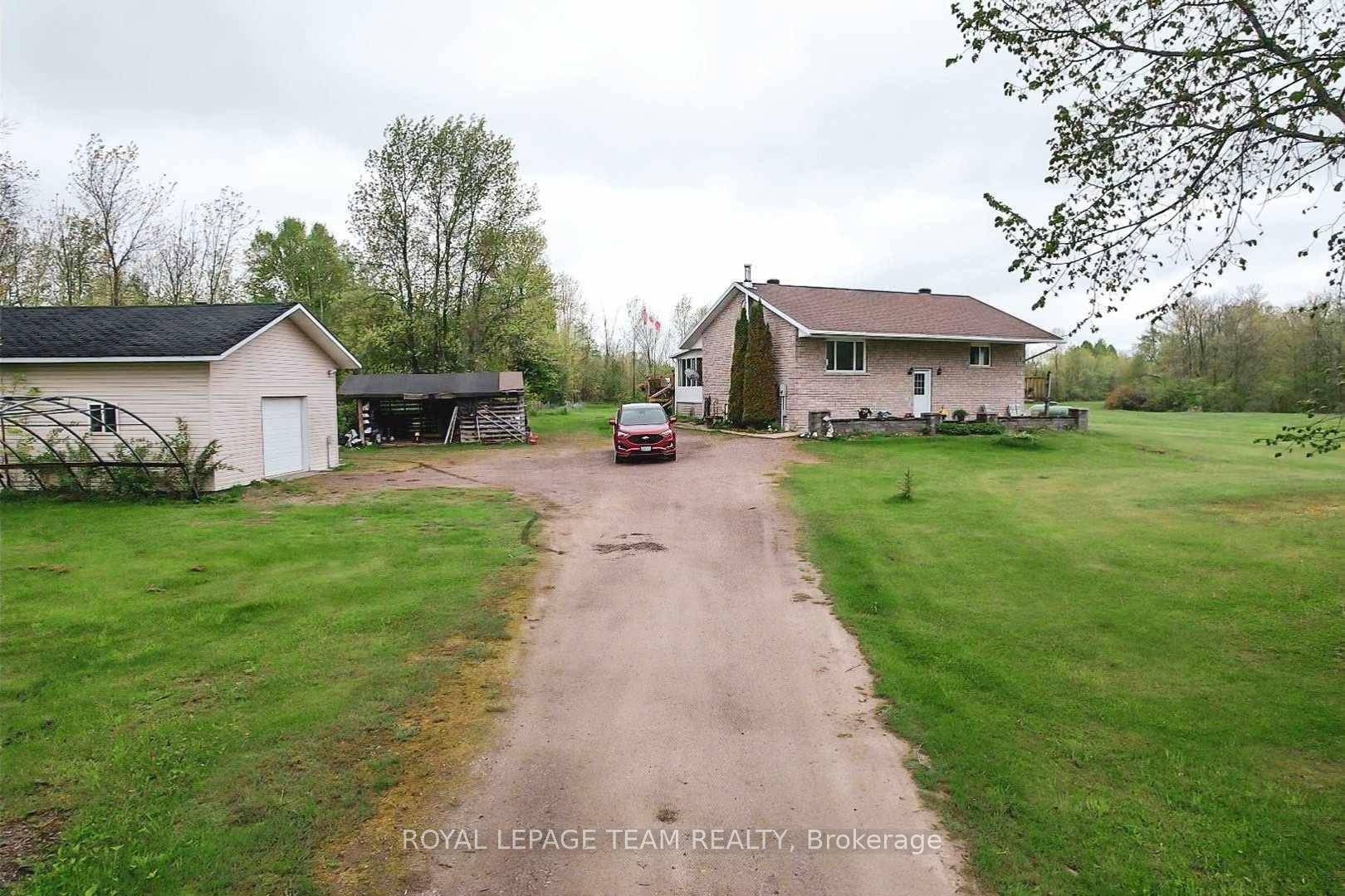 4 Bedroom 2003 built Home with a Detached Garage On TWO ACRES of Privacy !