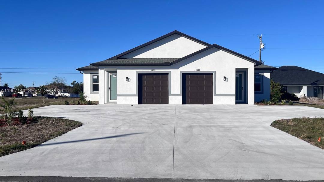 Ready to move in, this brand new construction duplex in Cape Coral offers a luxurious Southwest Florida lifestyle.