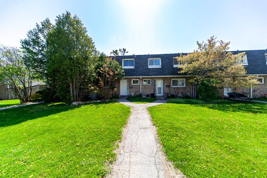 Welcome to this rare and uniquely located townhome, nestled within the tranquil and family friendly Brant Gardens complex.