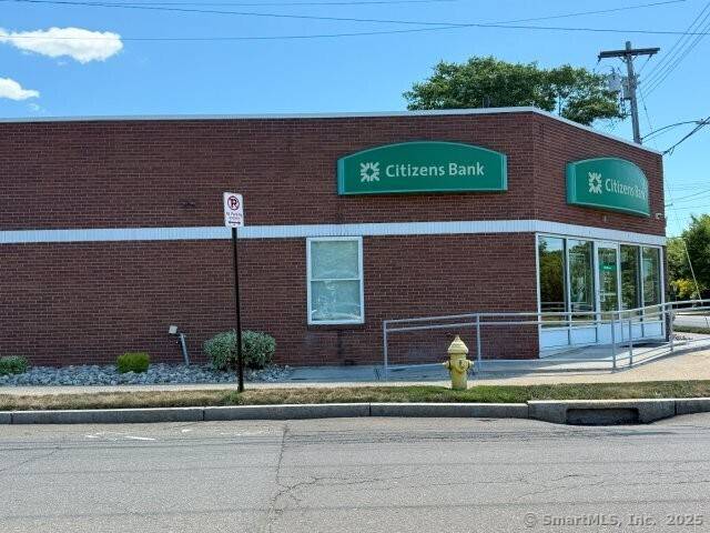 Positioned on a prominent corner lot, this freestanding commercial building is leased to Citizens Bank, a long term tenant.